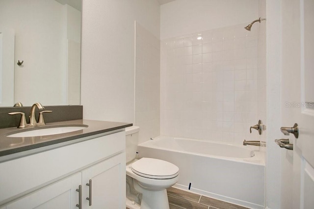 full bathroom with toilet, wood-type flooring, tub / shower combination, and vanity