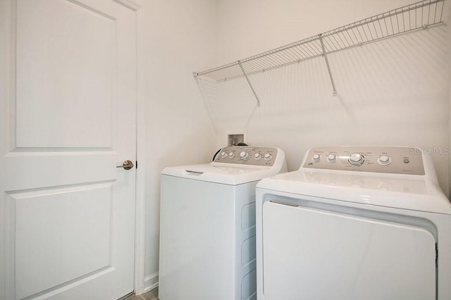 washroom featuring washer and dryer