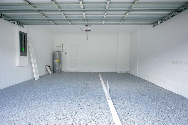 garage featuring electric water heater, a garage door opener, and electric panel