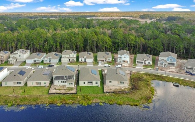 2971 Camden Way, Davenport, FL 33837 - aerial perspective of suburban area with a heavily wooded area and a nearby body of water