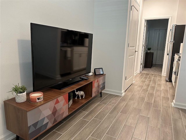 corridor with light hardwood / wood-style floors