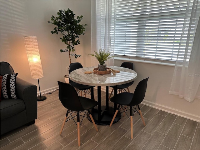 dining area with hardwood / wood-style floors