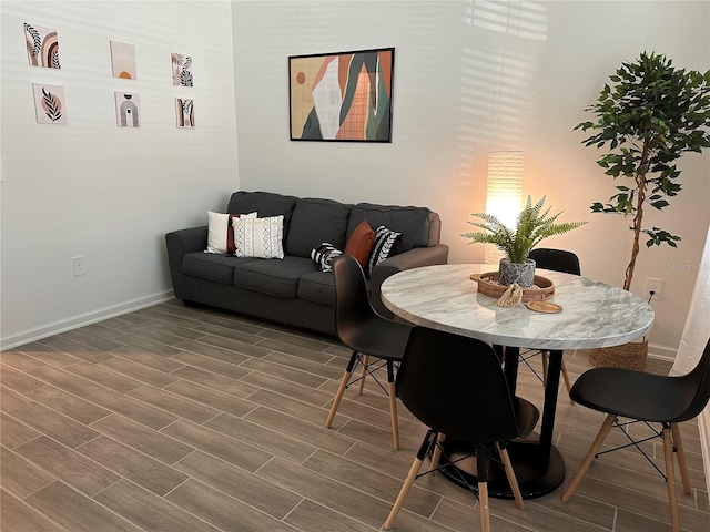 dining area with wood-type flooring