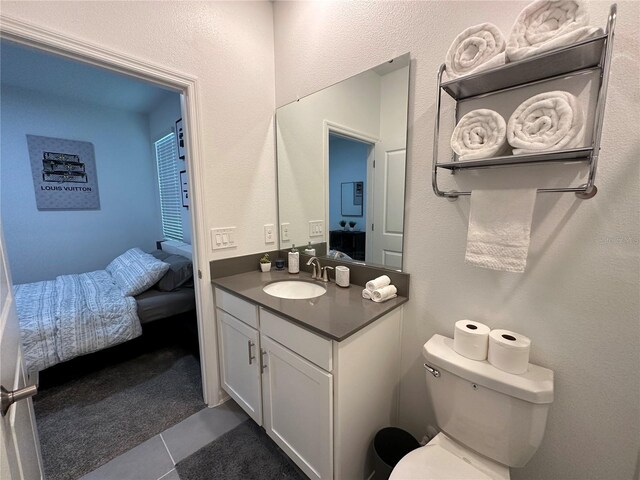 2971 Camden Way, Davenport, FL 33837 - ensuite bathroom featuring vanity, toilet, and tile patterned flooring