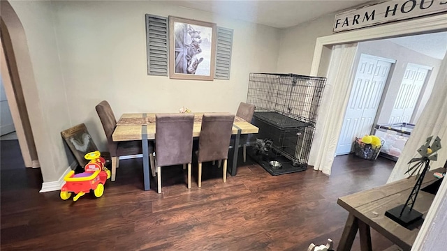 dining area featuring dark hardwood / wood-style floors