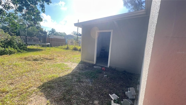 view of yard featuring a trampoline