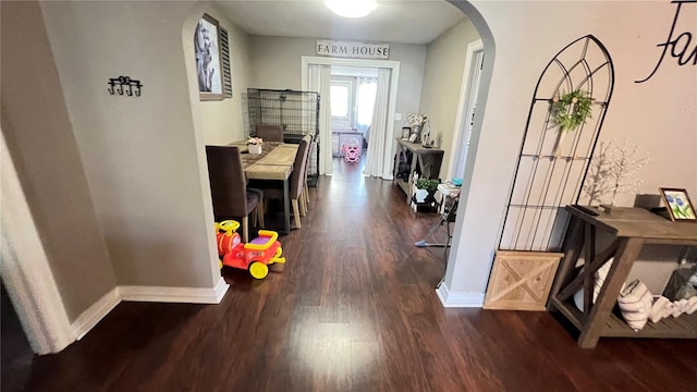 corridor with dark wood-type flooring