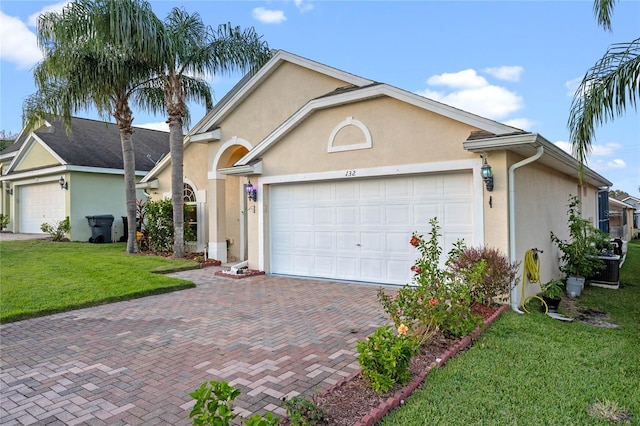 ranch-style house with a garage and a front lawn