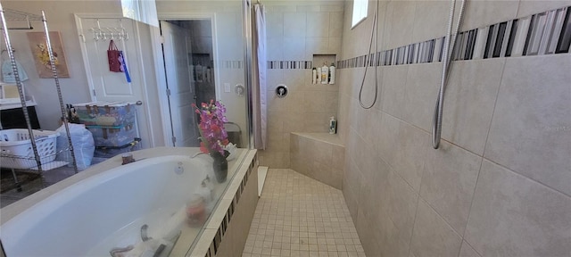 bathroom featuring separate shower and tub