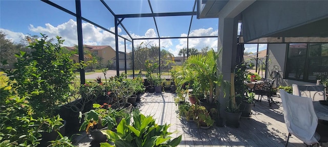 view of patio featuring glass enclosure