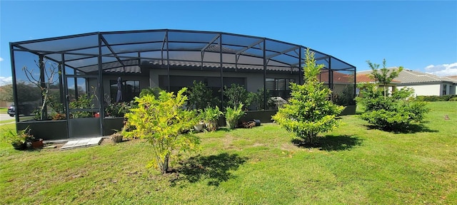 view of yard with glass enclosure