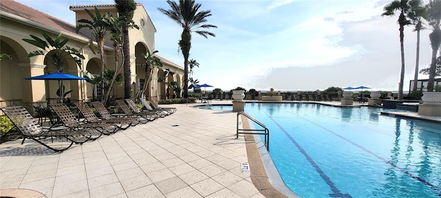 view of swimming pool with a patio area