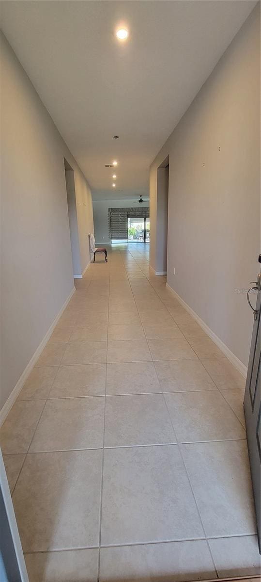 hallway with light tile patterned floors