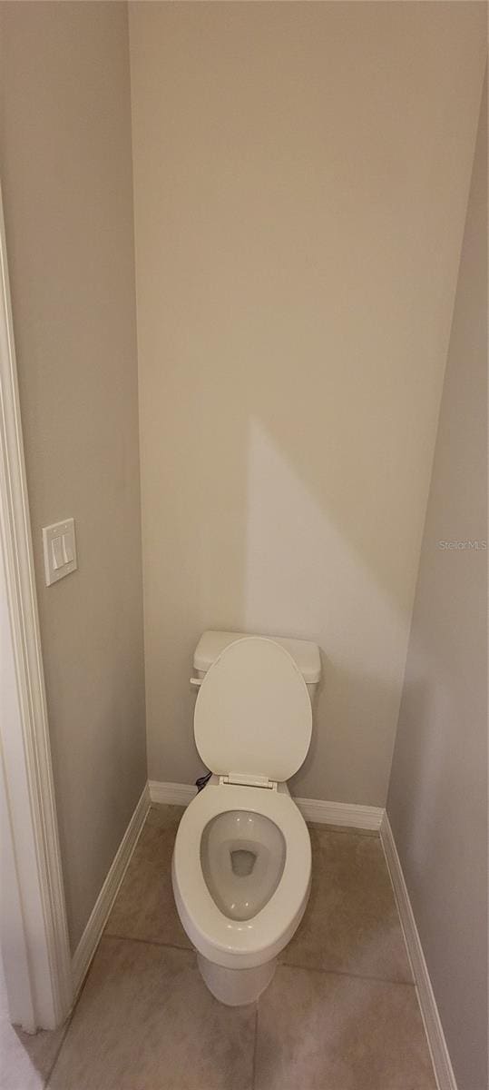 bathroom featuring tile patterned floors and toilet