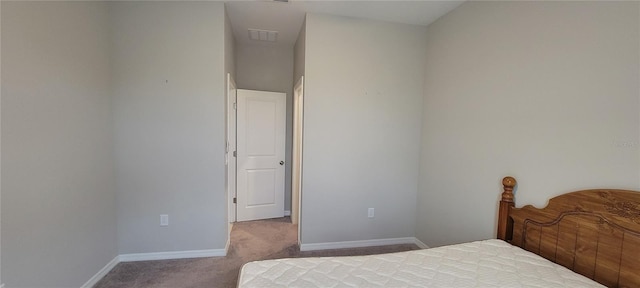 bedroom featuring light colored carpet