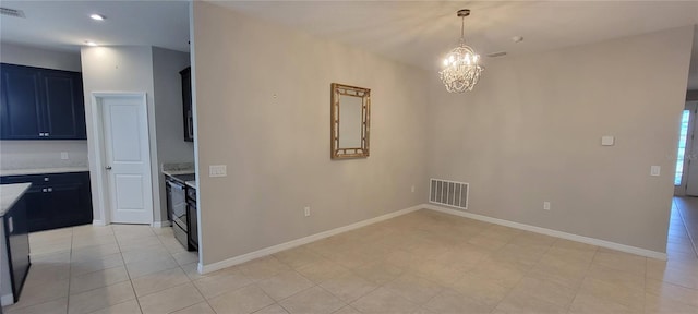 interior space featuring light tile patterned floors and a chandelier