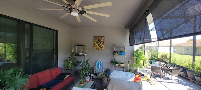 view of patio with outdoor lounge area and ceiling fan