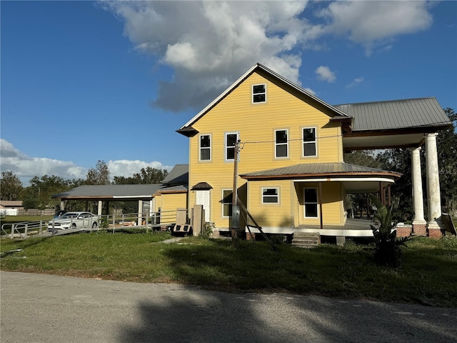 farmhouse-style home featuring a front yard and a porch