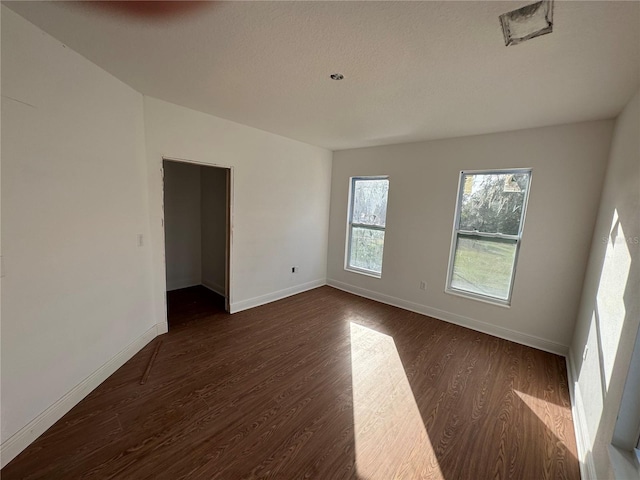 unfurnished room featuring dark hardwood / wood-style floors