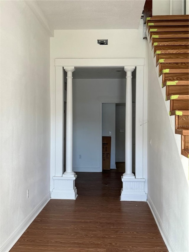 corridor featuring dark hardwood / wood-style flooring