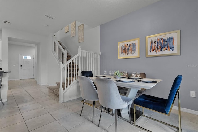 dining room featuring light tile patterned floors