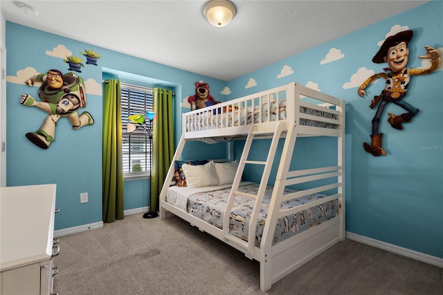 carpeted bedroom with a textured ceiling