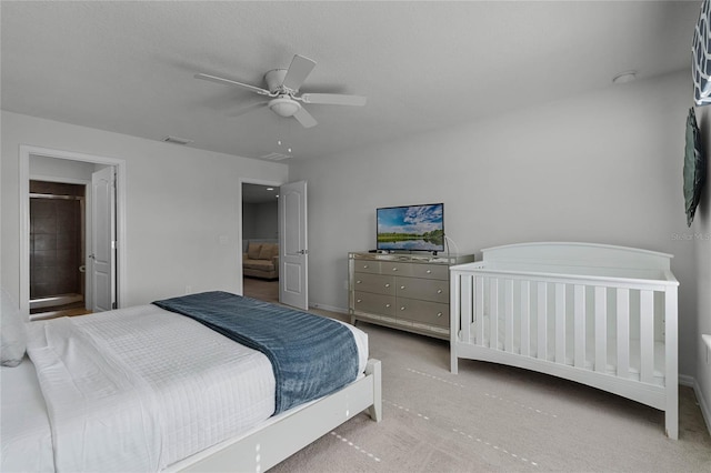 bedroom with light carpet and ceiling fan