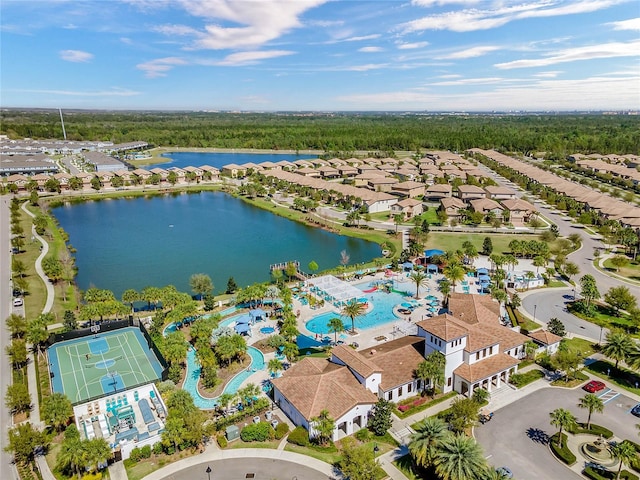 birds eye view of property with a water view