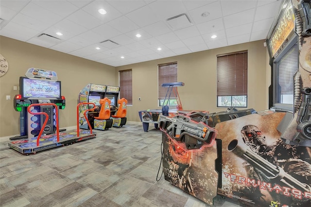 playroom with a paneled ceiling