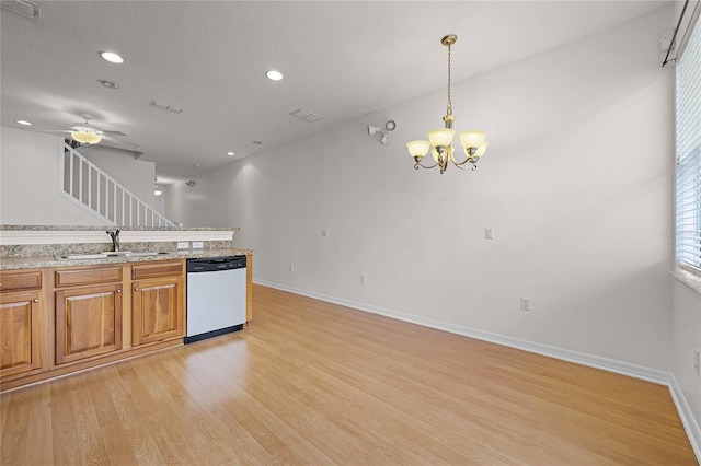 kitchen featuring sink, white dishwasher, light hardwood / wood-style floors, decorative light fixtures, and ceiling fan with notable chandelier