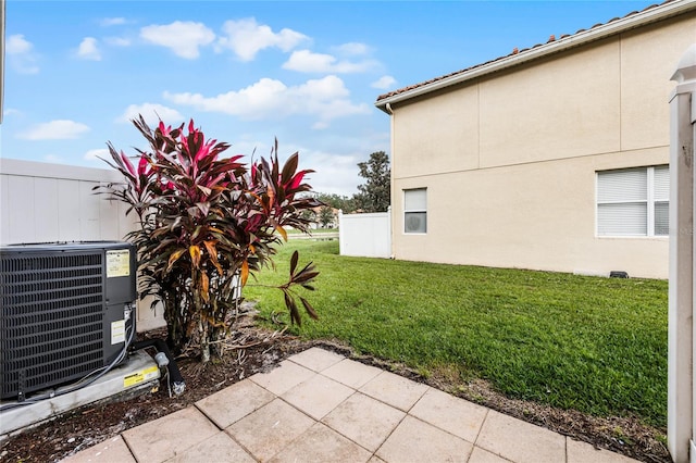 view of yard featuring central AC