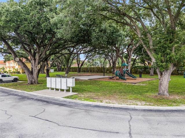 view of jungle gym featuring a lawn