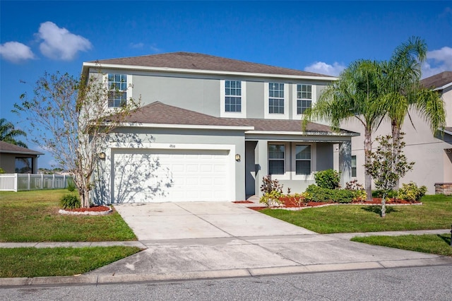 view of front property featuring a garage and a front yard