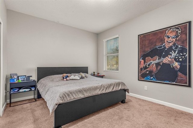 bedroom with light colored carpet