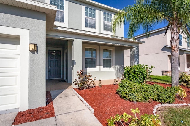 property entrance with a garage