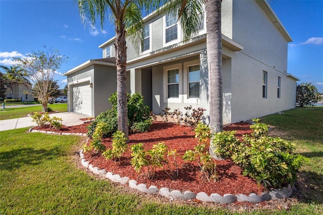 view of front of house featuring a garage and a front lawn