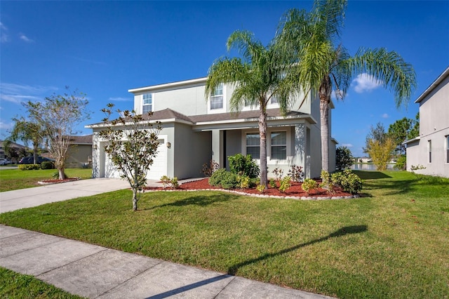 view of front of house featuring a garage and a front lawn