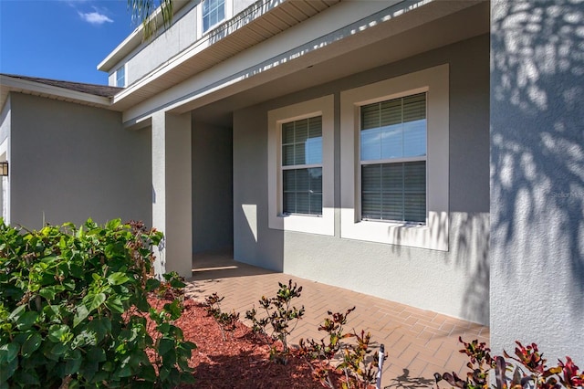 doorway to property with a patio area