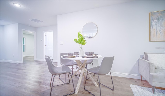 17207 Waldrun Ave, Port Charlotte, FL 33948 - dining room featuring wood finished floors, baseboards, and recessed lighting