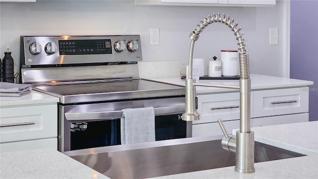 17207 Waldrun Ave, Port Charlotte, FL 33948 - kitchen view of white cabinets and light stone counters