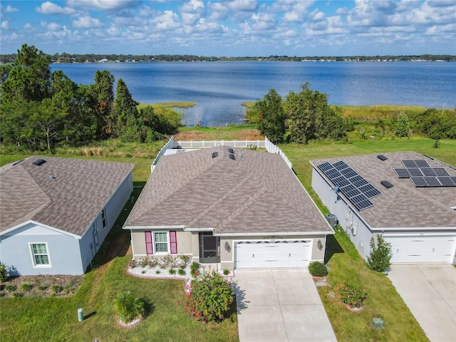 drone / aerial view with a water view