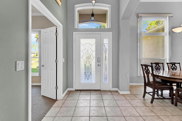 foyer featuring light tile patterned flooring