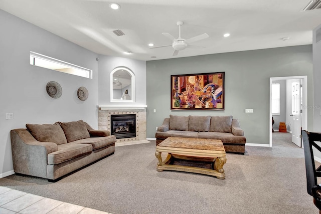 living room with ceiling fan and light colored carpet