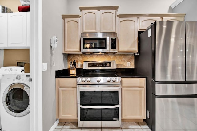 kitchen with washer / clothes dryer, light brown cabinets, and appliances with stainless steel finishes