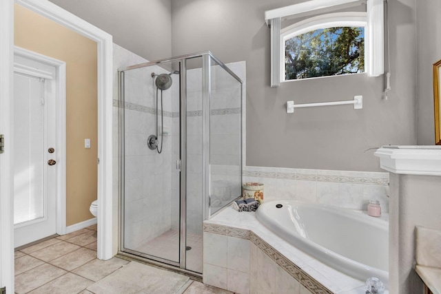 bathroom with separate shower and tub, tile patterned floors, and toilet