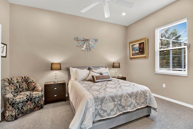 bedroom featuring light carpet and ceiling fan