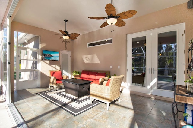 sunroom with ceiling fan and french doors