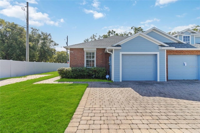 3401 Home Town Ln, Saint Cloud, FL 34769 - view of front facade featuring brick siding, a garage, and decorative driveway