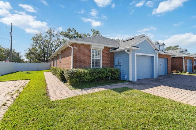 3401 Home Town Ln, Saint Cloud, FL 34769 - view of front facade featuring an attached garage, decorative driveway, brick siding, and a shingled roof