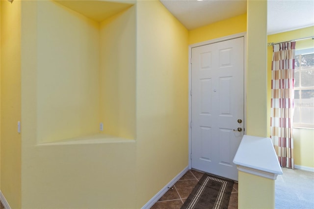 3401 Home Town Ln, Saint Cloud, FL 34769 - entryway with baseboards and dark tile patterned floors